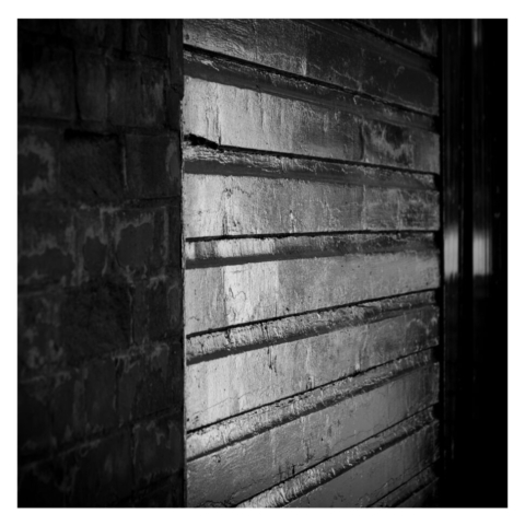 Outside of a wooden hut