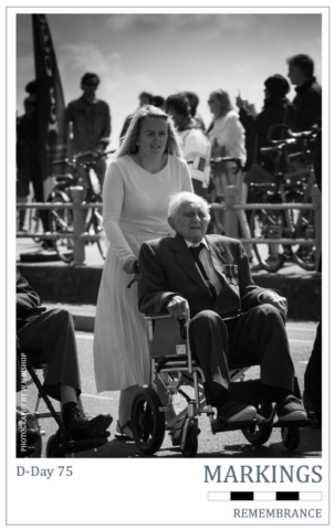 D-Day 75 Markings Series- Veteran Veteran being pushed in a wheelchair during the commemorations
