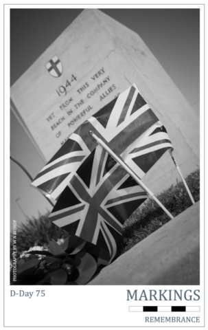 D-Day 75 Markings Series - D-Day Stone Union Jack flags in front of the D-Day Stone