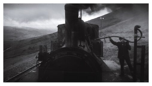 A Snowdon railway steam train stops to take on water on the way to the summit of Yr Wyddfa