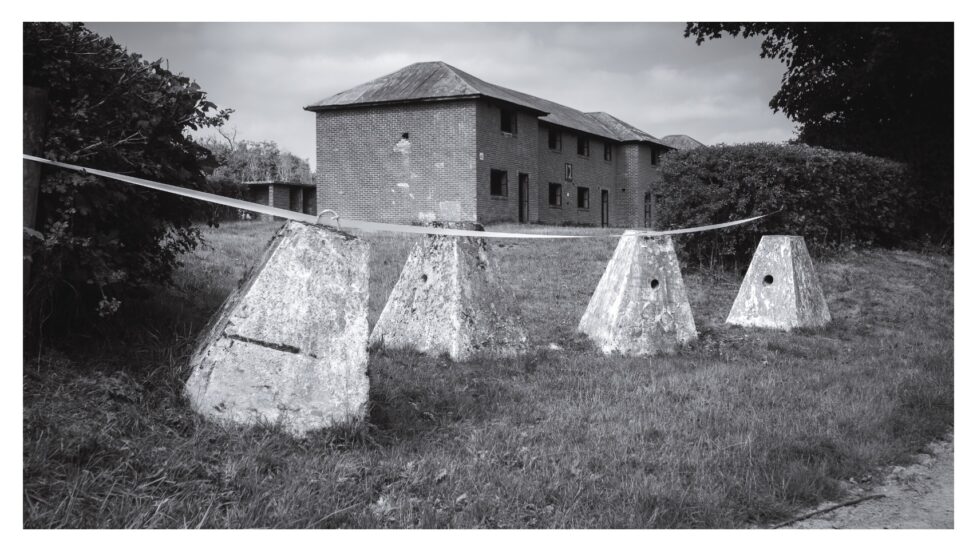 'Dragons Teeth' antitank defences in front of 'House-like' buildings constructed to aid urban warfare training