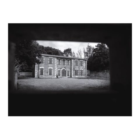 Imber Court Manor House with the window shuttered up