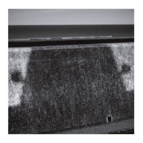 Aberaeron Costal Defence Scheme - car shadow on the sea wall
